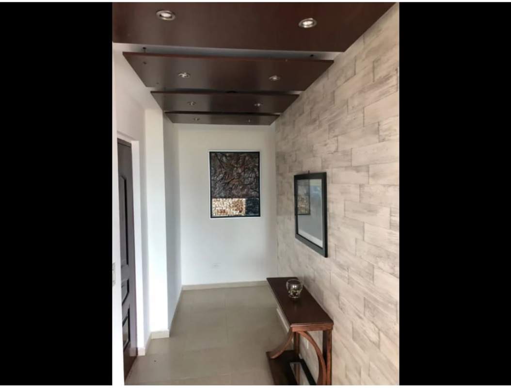 Kitchen with granite countertops and stainless appliances in PH Oasis Tower apartment