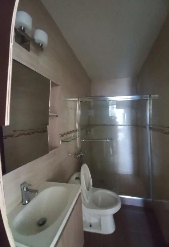 Bathroom with glass-panel shower mirror sink modern features PH San Francisco Bay Panama City