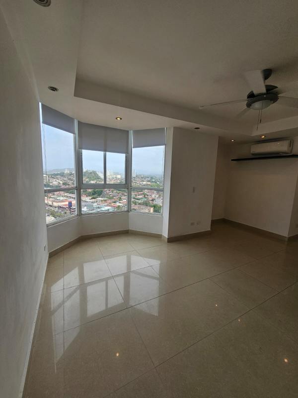 Open dining and living area with large windows and city views at PH Dos Mares View Panama