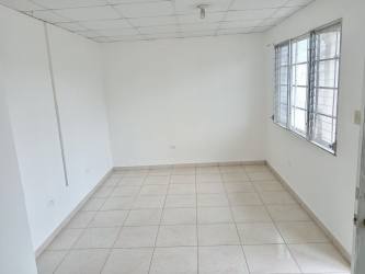 Front view of single-story house with driveway and fenced yard in Quintas del Pacífico La Chorrera Panama