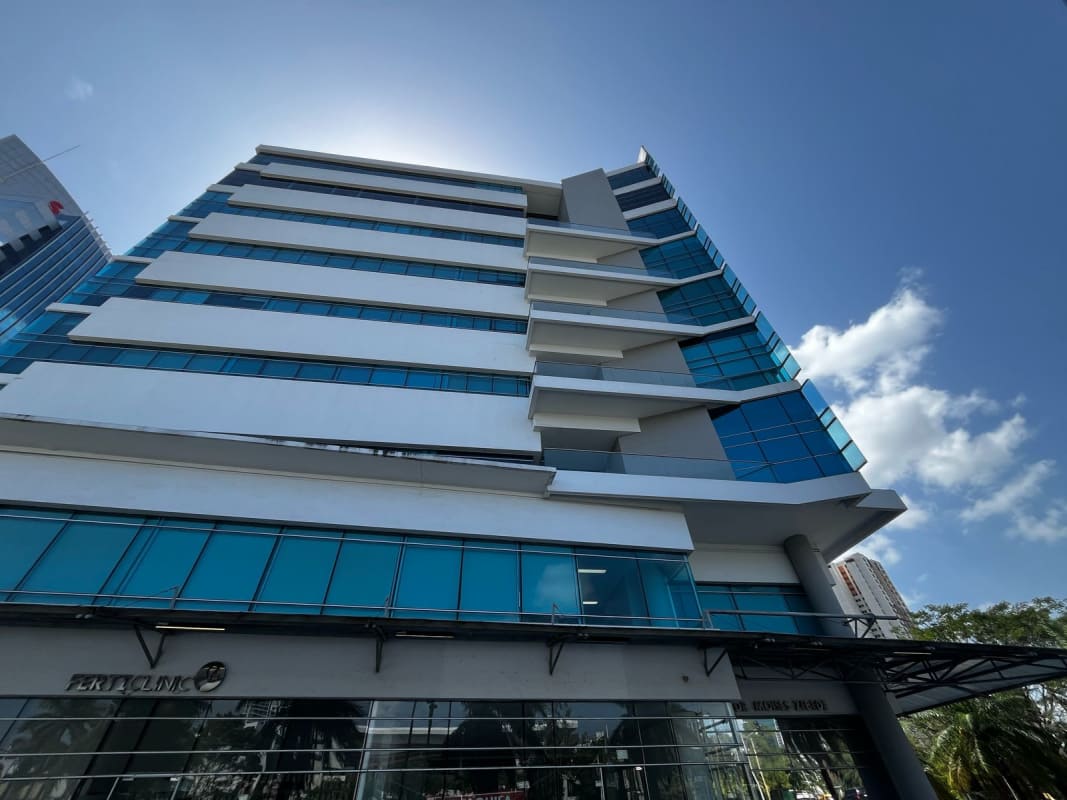 Multi-story glass commercial building Pacific Salud Tower in Punta Pacifica with modern facade