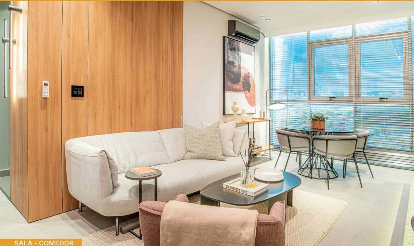 Modern lounge with library shelves in PH Vía España Park Lefevre Panama City