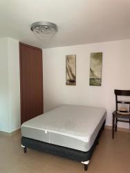 Simple bedroom with minimalist decor tile floor and window at PH Ocean Front Gorgona Panama