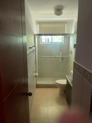 Contemporary bathroom with glass shower enclosure tile in PH Ocean Front Nueva Gorgona