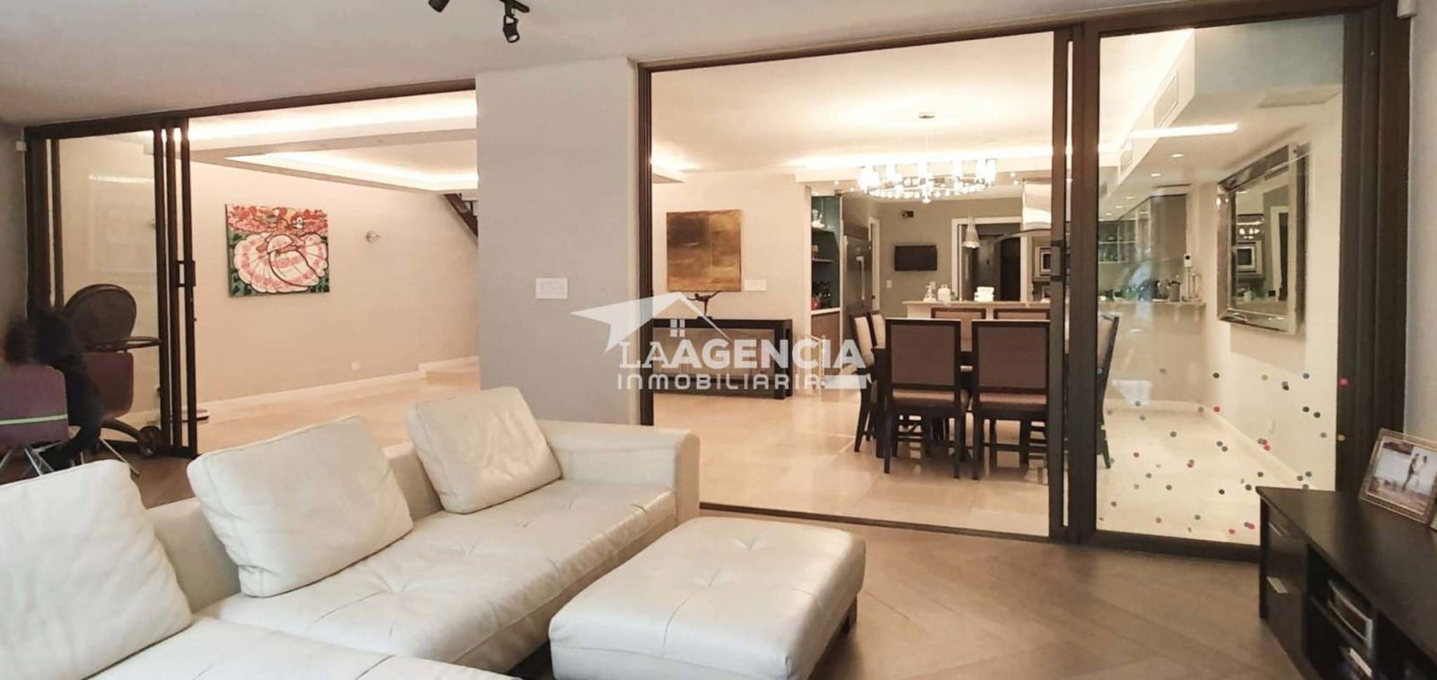 Luxury open plan living and dining space with ceiling lights and ocean view in Punta Paitilla