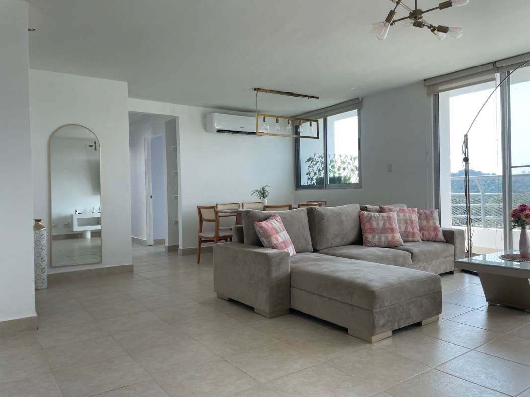 Spacious living dining room with large windows and balcony access at Clayton Park Residences