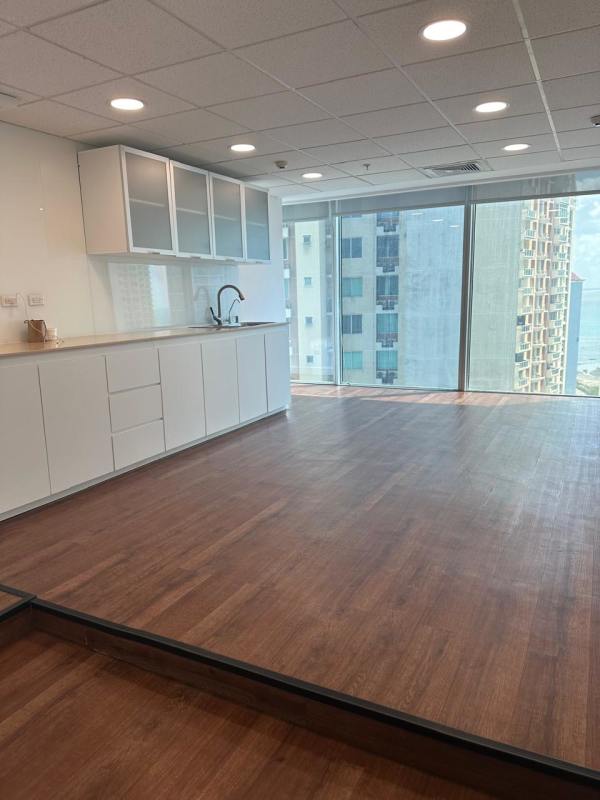 Modern kitchen with large windows and ocean plus skyline views, PH Oceanía Panama