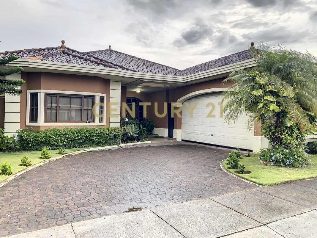 Bright home gym with mirrored wall, windows, and exercise equipment in PH Sunset Coast Panama