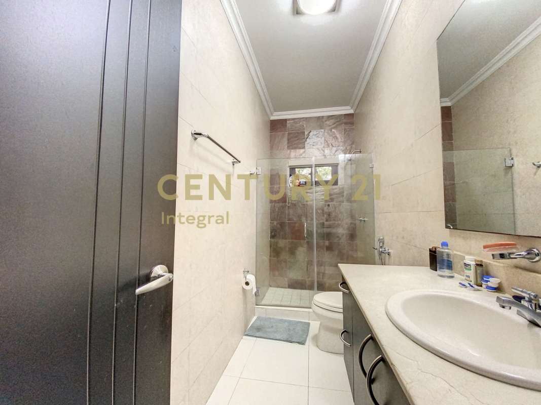 Bathroom featuring glass shower enclosure and modern fixtures in PH Sunset Coast Costa Sur Panama