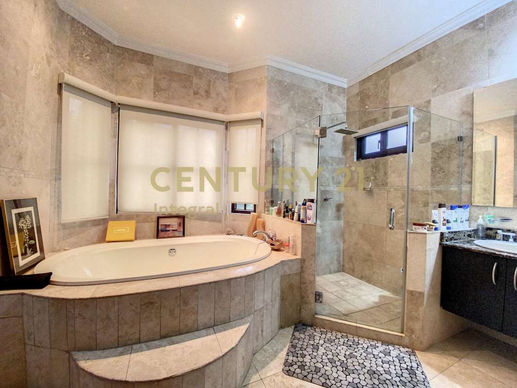 Spacious master bath with soaking tub, glass shower and stone tile PH Sunset Coast Costa Sur