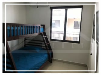 Bedroom with bunk bed, tile floor, AC unit in PH Midrise Panama Pacifico