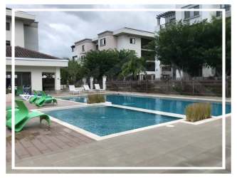 Modern gym with cardio and weight equipment at PH Midrise Panama Pacifico