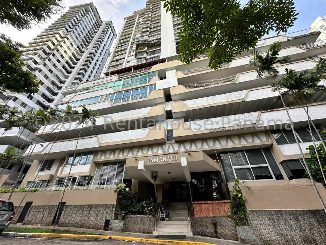 Modern condominium tower PH Tamanaco with balconies and palm trees Punta Paitilla Panama