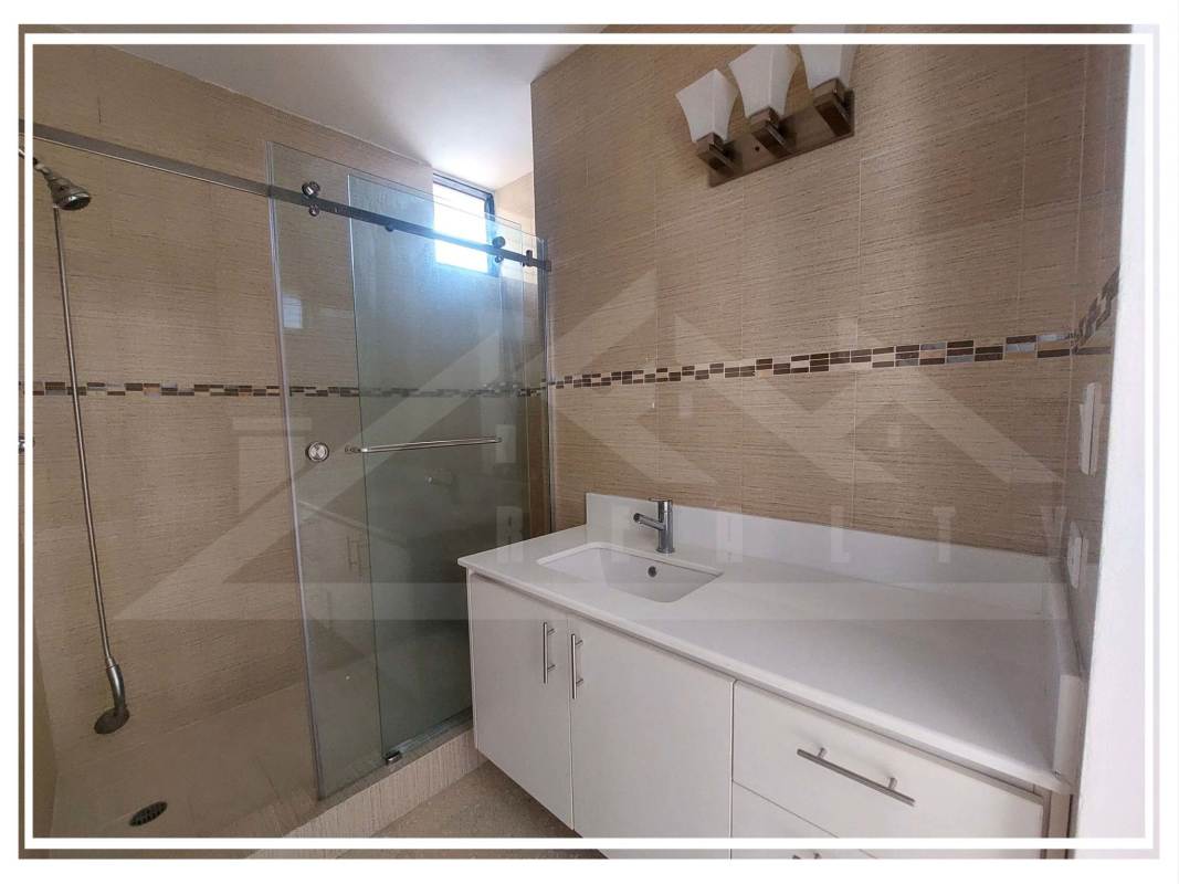 Modern bathroom with shower enclosure and vanity in PH Park Loft Obarrio Panama City