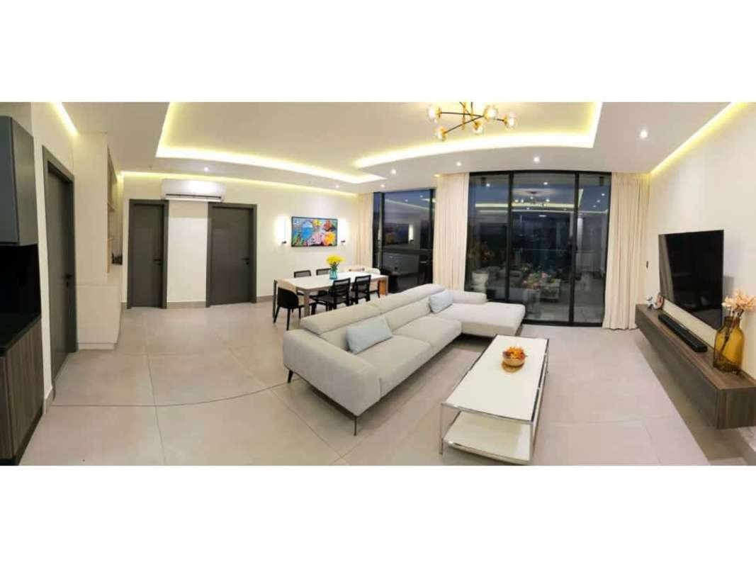 Modern kitchen with granite countertops and built-in stove PH Victory Point Coco del Mar Panama