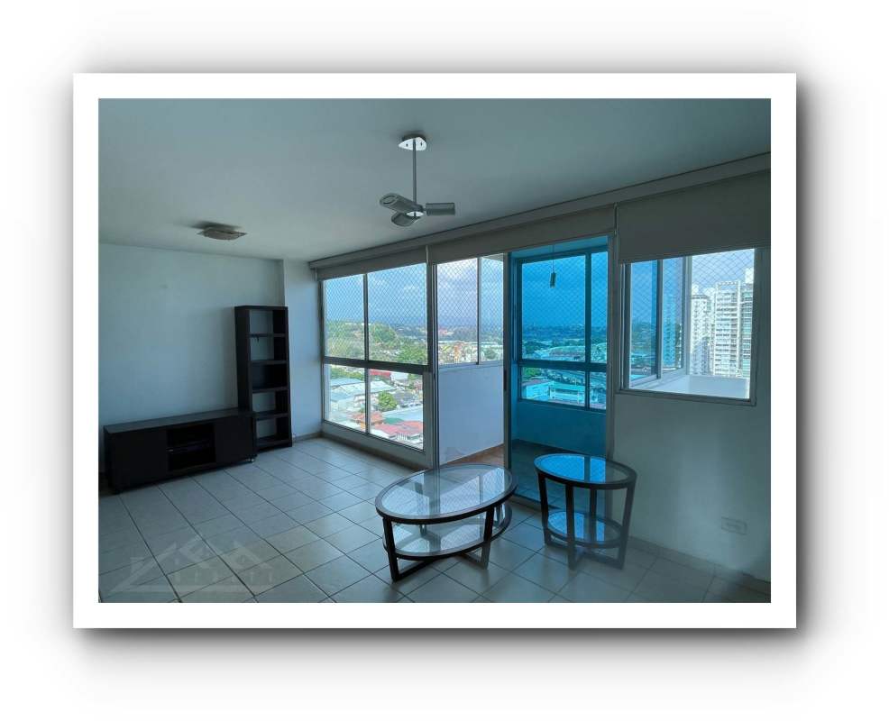 Modern living room with large windows and balcony access in PH Betania Towers Betania Panama