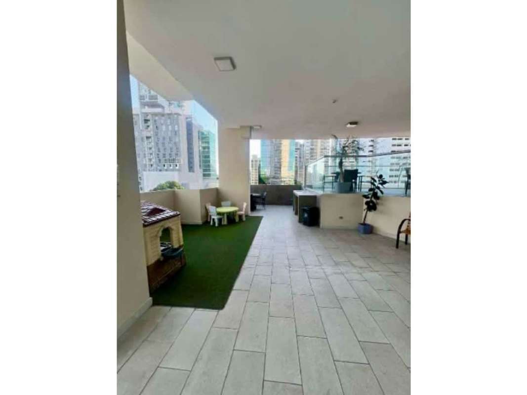 Covered terrace lounge area overlooking city at PH Diamond Tower San Francisco Panama