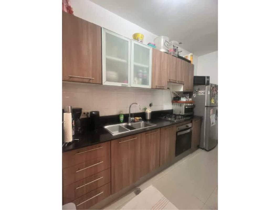 Kitchen with wooden cabinets and granite countertops in apartment PH Diamond Tower Panama