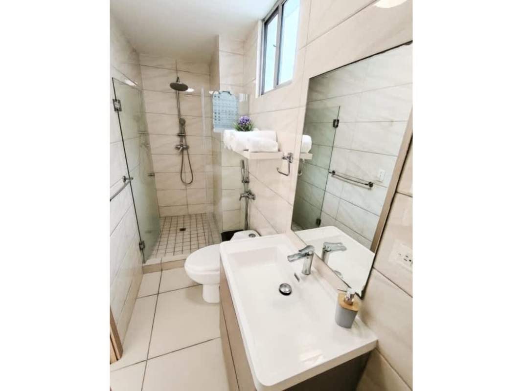 Bathroom with glass shower and modern tiles in PH Torres de Castilla Panama