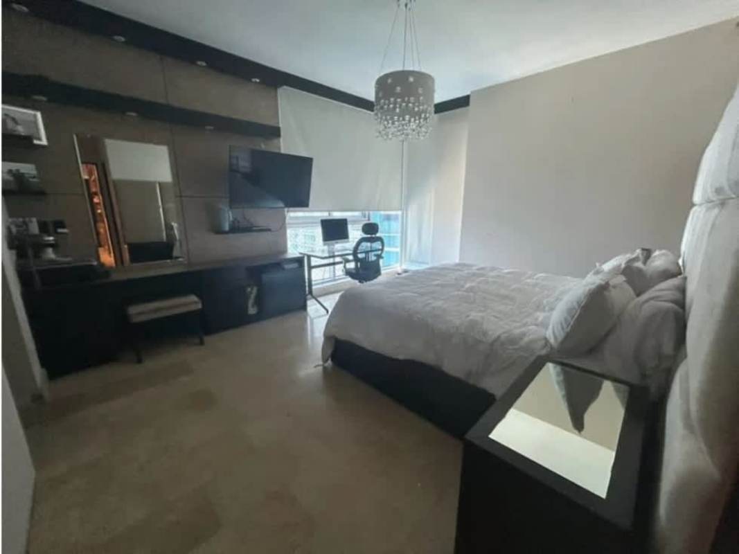 Formal dining area with designer lights and marble floors PH Oceanaire luxury apartment Panama