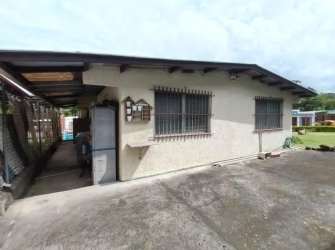 Backyard with flat roof house, barred windows, paved floor in Veracruz Arraiján Panama
