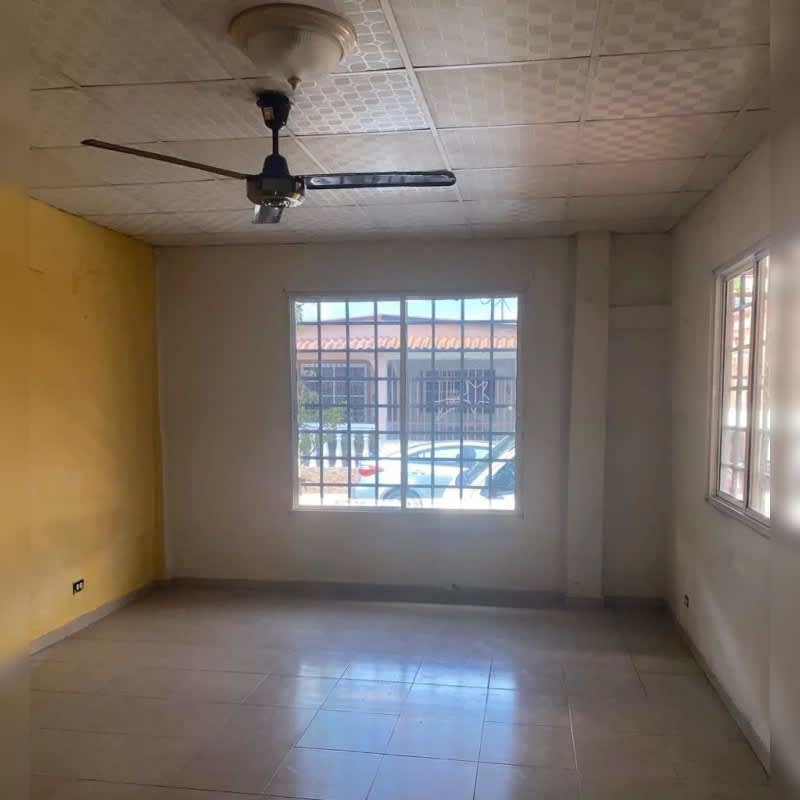 Unfurnished bedroom with wood wardrobe, tile floor, ceiling fan, Villa Lucre rental Panama