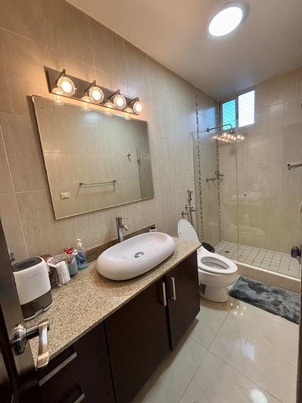 Bedroom with wooden flooring blue accent wall built-in closet PH Pacific Point Punta Pacifica Panama