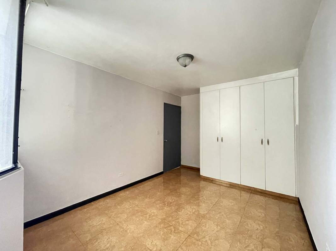 Kitchen featuring stove, oven, refrigerator, cabinets and window in Villa de las Fuentes Panama