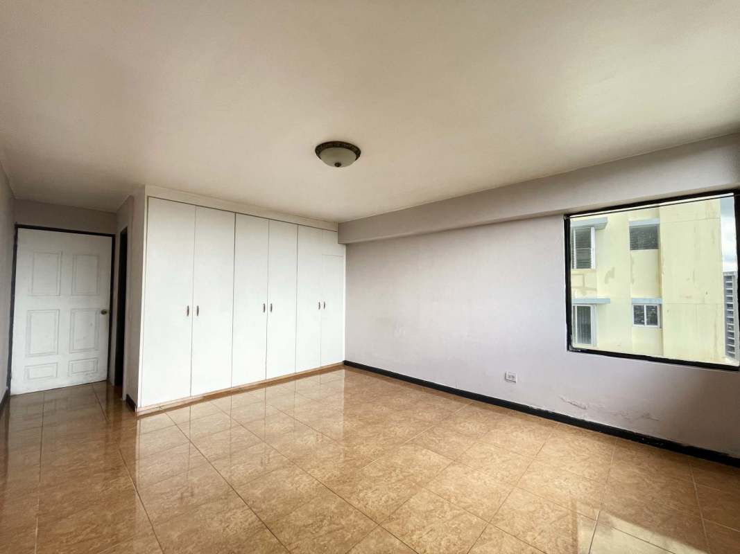 Second bedroom with built-in closet, window and AC in Villa de las Fuentes Panama City