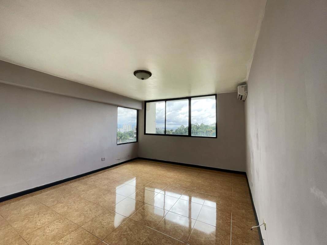 Bright bathroom featuring glass shower enclosure, pedestal sink and ceramic tiles in Panama City