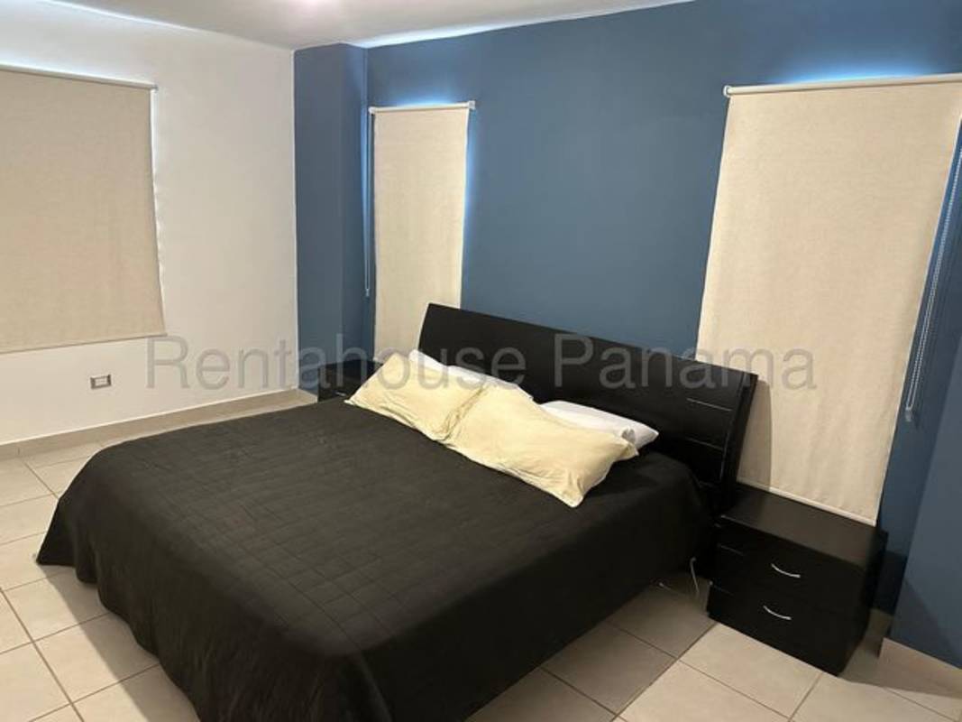 Furnished secondary bedroom with window and tile floors PH Victoria Panama City