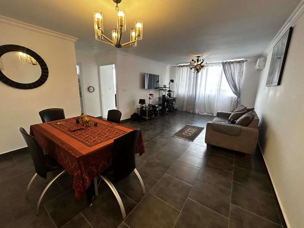 Dining area adjacent to kitchen with tile floor, pendant lighting, in PH Brisas San Fernando Panama