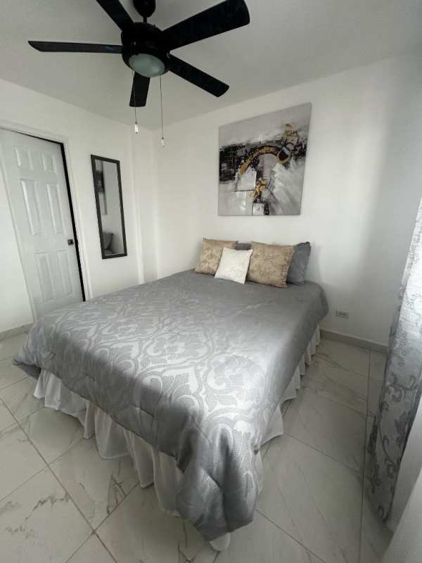 Bright living-dining space with tile flooring, large windows, modern decor in PH Brisas de San Fernando Panama