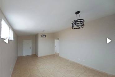 Bedroom with built-in wardrobe, large window in rental house Panama