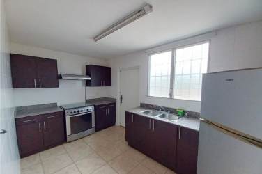 Master bedroom with ensuite bathroom, tile floors in rental house Brisas del Golf Panama