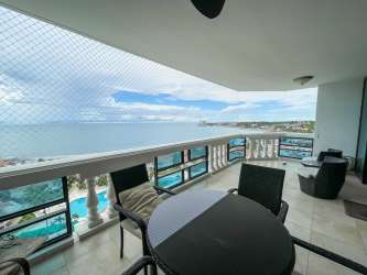 Balcony with outdoor dining set overlooking Pacific ocean and pools Coronado Country Club Panama