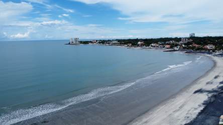 Modern renovated kitchen with granite countertops, wood cabinets and stainless refrigerator Panama condo