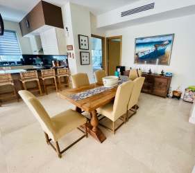 Spacious master bedroom with ocean views, large window and balcony access at PH Balboa V Bijao Beachfront Panama