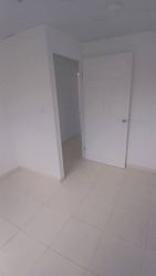 Empty bedroom with window and tile floor La Valdeza La Chorrera