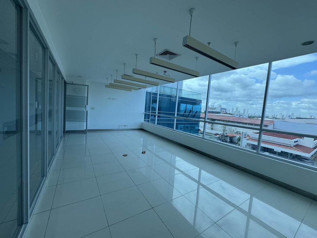Empty office space open plan with windows over Panama City in business tower