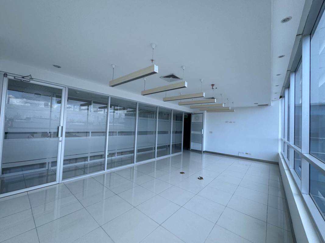 Large empty office with windows and recessed lighting in a modern Costa del Este tower Panama
