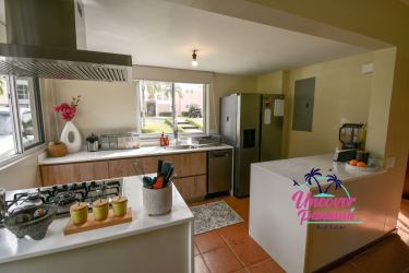 Contemporary kitchen with island, stainless appliances large window Costa Blanca Rio Hato Panama