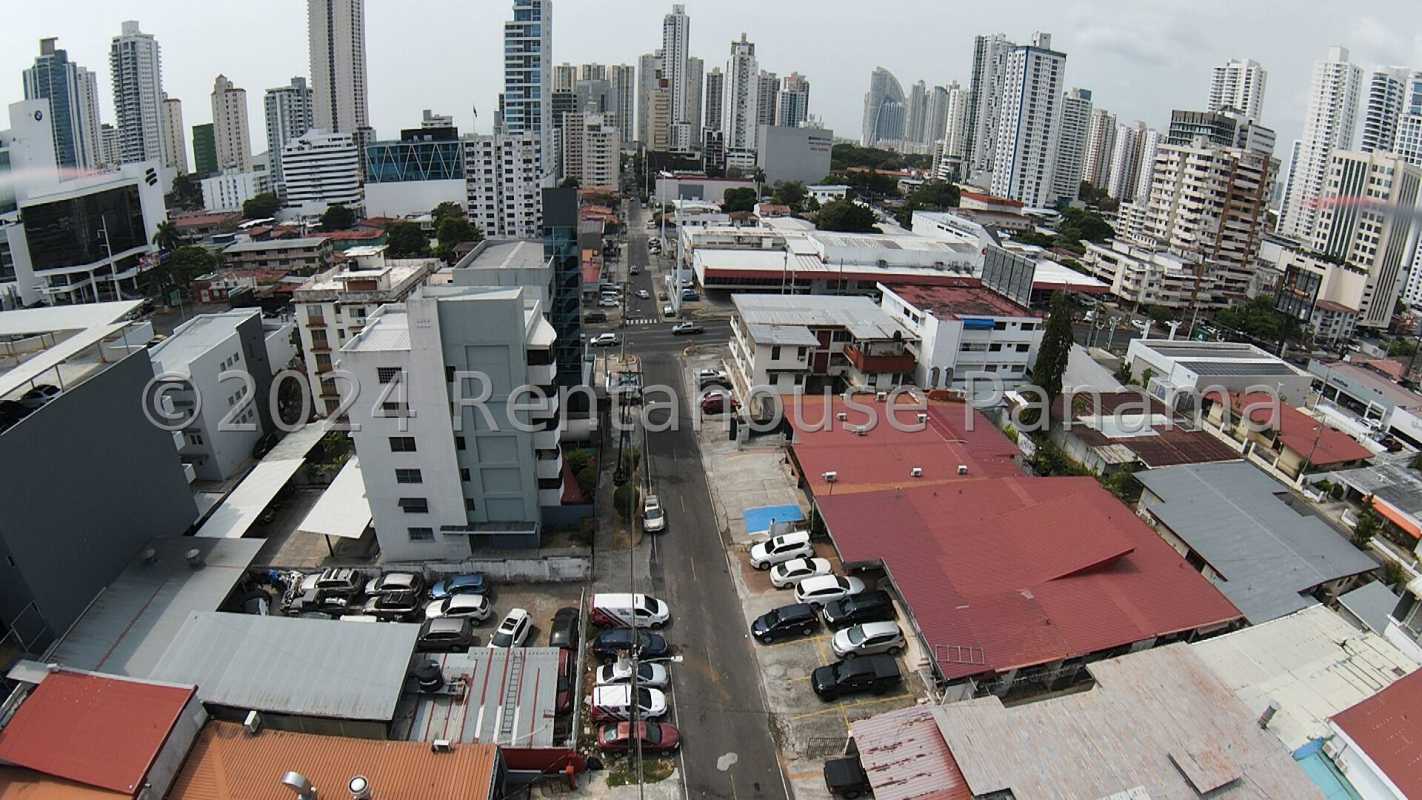 Aerial cityscape with commercial and residential buildings surrounding lot Panama City