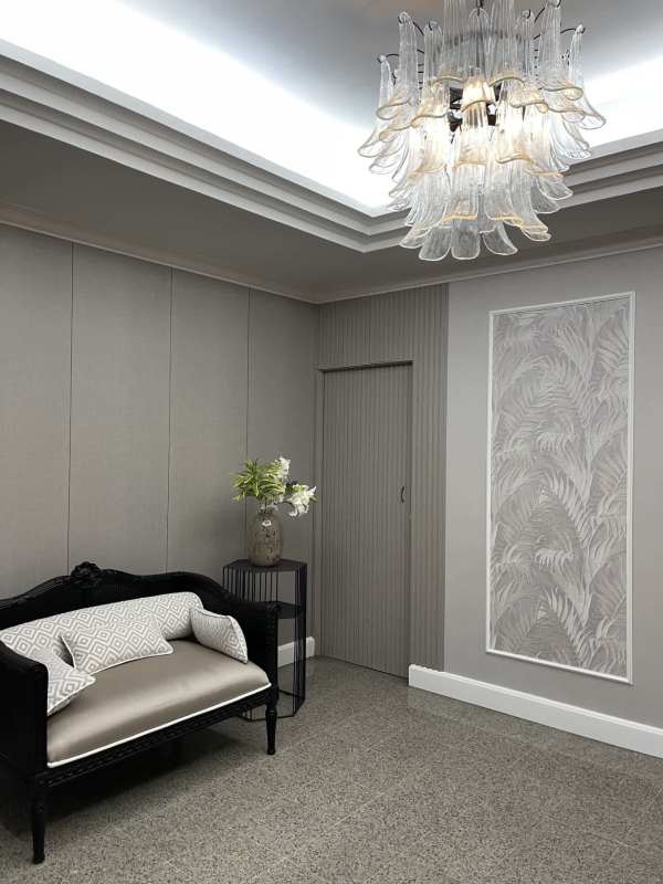 Modern lobby with marble floors and chandelier at PH La Cresta