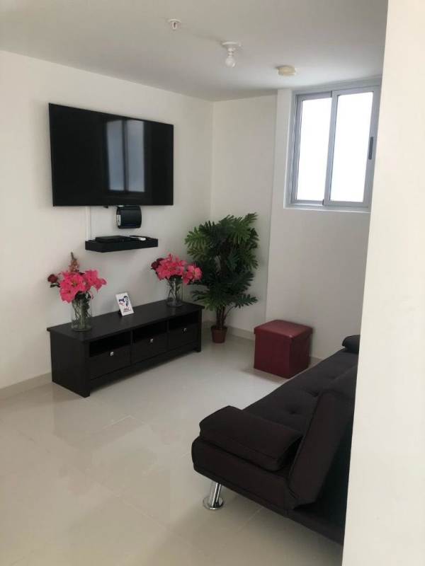 Modern living room with TV and natural light in PH Porto Alegre Panama