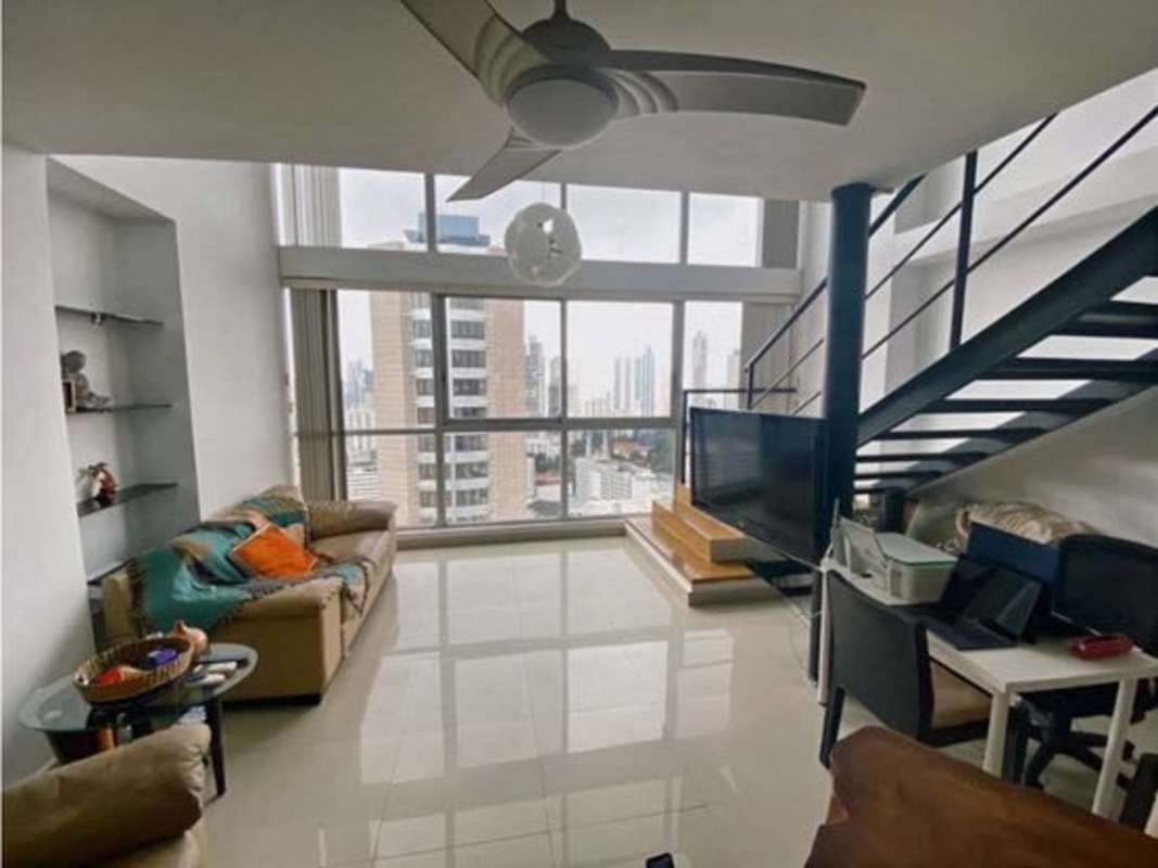 Open loft-style bedroom overlooking Panama skyline at PH Vitro Loft El Cangrejo