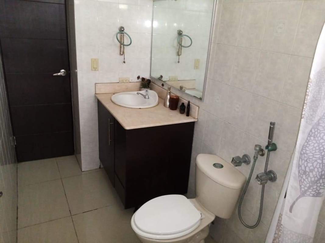 Urban skyline view from balcony with plants in PH Plaza Downtown El Cangrejo Panama City