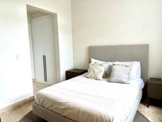 Waterfront condominium with marina and boat yachts at Marina Gardens Buenaventura Panama