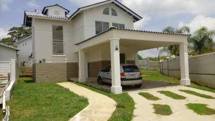 Covered driveway carport with greenery Playa Dorada house Panama