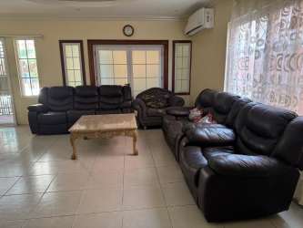 Open living and dining area with large sliding doors and tile flooring, Costa Verde Colón Panama